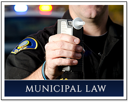 Officer Holding Breathalyzer Device, Criminal Defense, Hackensack, NJ